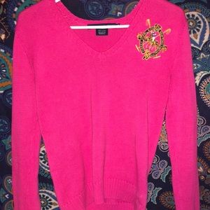 A pink Ralph Lauren sport sweater